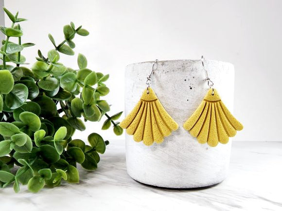 These polymer clay earrings are lightweight, eclectic and sure to make a statement. They feature a rich mustard colour that you can't help but fall in love with.