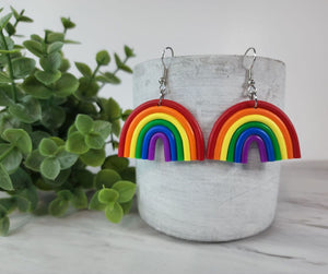 These polymer clay Rainbow earrings are lightweight, eclectic and sure to make a statement. With their bright colours, they are sure to bring your day joy & happiness! These Rainbow earrings represent pride for the pride community. Whether you identify as such, you can show your support or simply wear them because they are gorgeous.