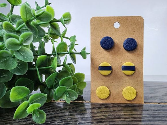 These cute and stylish polymer clay stud earrings are lightweight, eclectic and sure to make a statement. This set features 3 cute round studs in navy & mustard.   This set includes 3 pairs of polymer clay stud earrings.